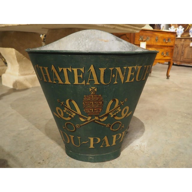 Hottes were used during the 19th and early 20th centuries for collecting grapes at French vineyards. The vineyard employee...