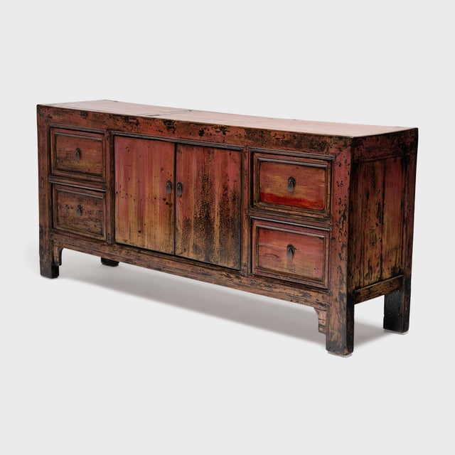 This antique Chinese sideboard from the early 20th century balances a streamlined silhouette with textured, wabi-sabi...