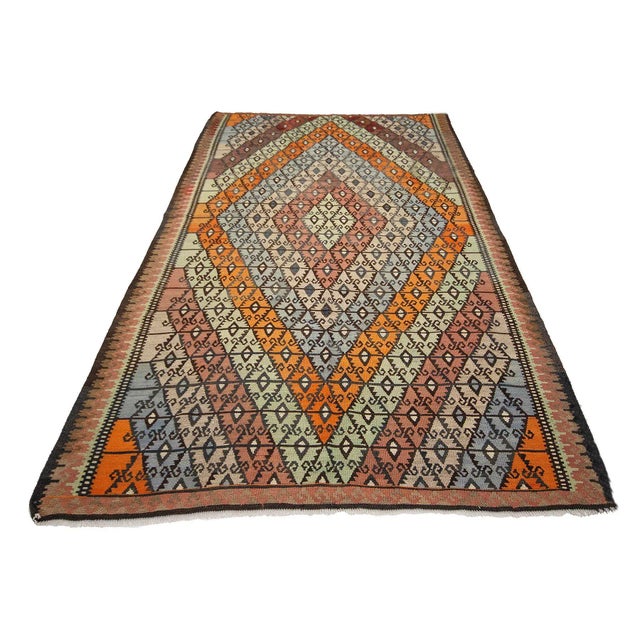 Vintage handwoven kilim rug from Kars region of Turkey. Approximately 55-65 years old. In very good condition.
