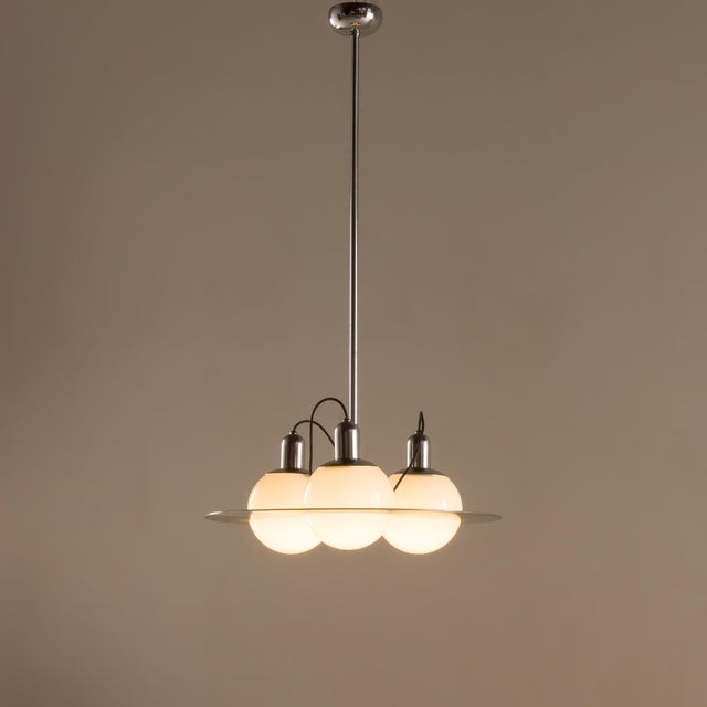 This Italian Space Age chandelier from the 1970s is a striking example of futuristic lighting design, combining sculptural...