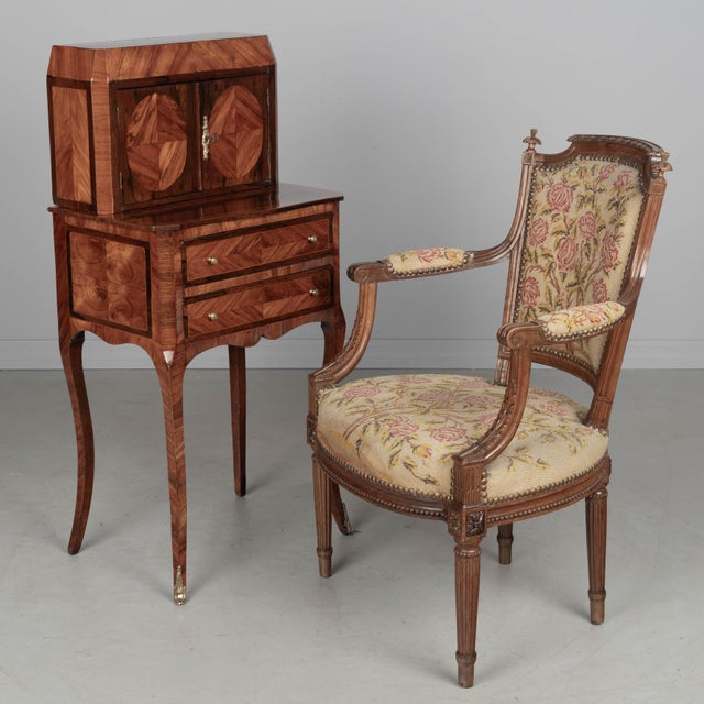 An 18th Century French Louis XVI bonheur du jour ("happiness of the day") side table finely crafted with intricate...