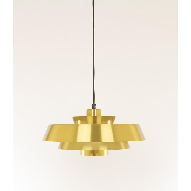 Brass Nova pendant designed in the 1960s by Jo Hammerborg, main designer of Danish lighting manufacturer Fog & Mørup in...