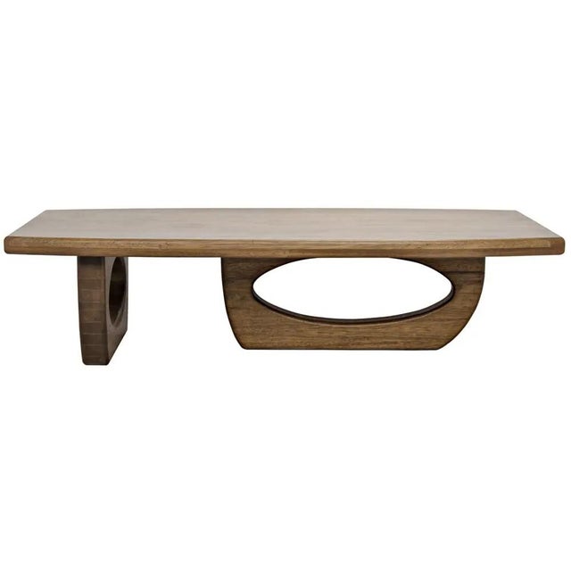 A rectangular coffee table is given an organic edge with a driftwood inspired base. Created by hand of walnut, a dark...