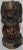 This is a unique early 19th century wooden carving depicting a stylized lion in black distressed paint, posed rampant on a...