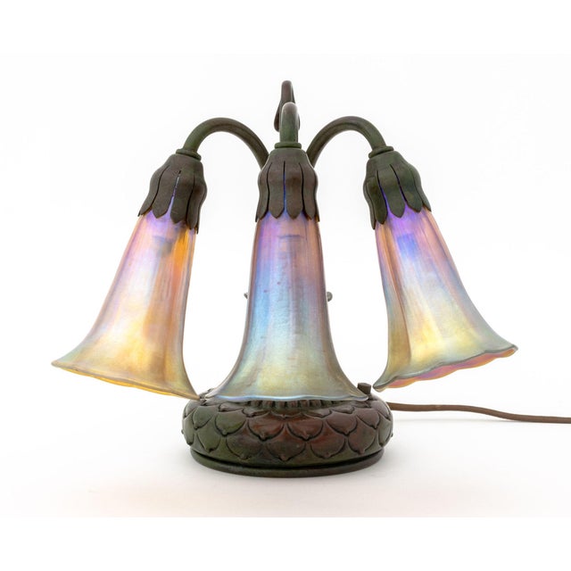 Tiffany Studios Three-Light "Lily" Table Lamp, the verdigris patinated bronze base struck "Tiffany Studios / New York /...
