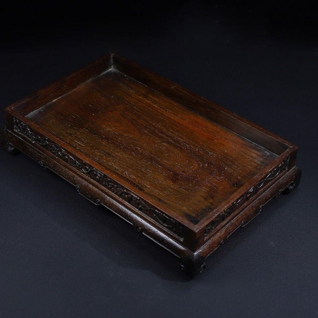 A beautifully crafted Chinese hardwood tray or display stand, likely made of Huali (rosewood). The piece features a...