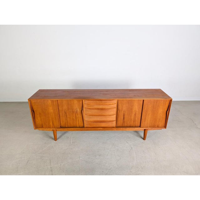 We are offering a beautiful Danish teak sideboard from the 1960s for sale. The model, designated "7738," was designed by...