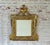 18th Century Italian Neoclassic Giltwood Mirror. The rectangular frame is richly carved with a continuous border of...