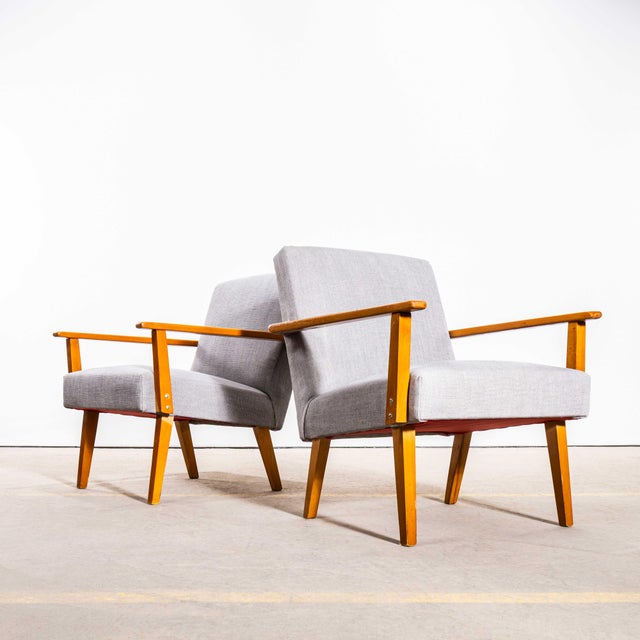 1950’s Mid Century Grey Brushed Cotton Upholstered Armchairs with Straight Arms and Top Caps. Sourced in Scandinavia these...