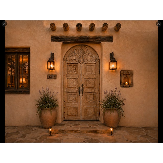 This Antique Indian Bleached Teakwood Door features an arched crown and beautifully hand-carved detailing throughout....