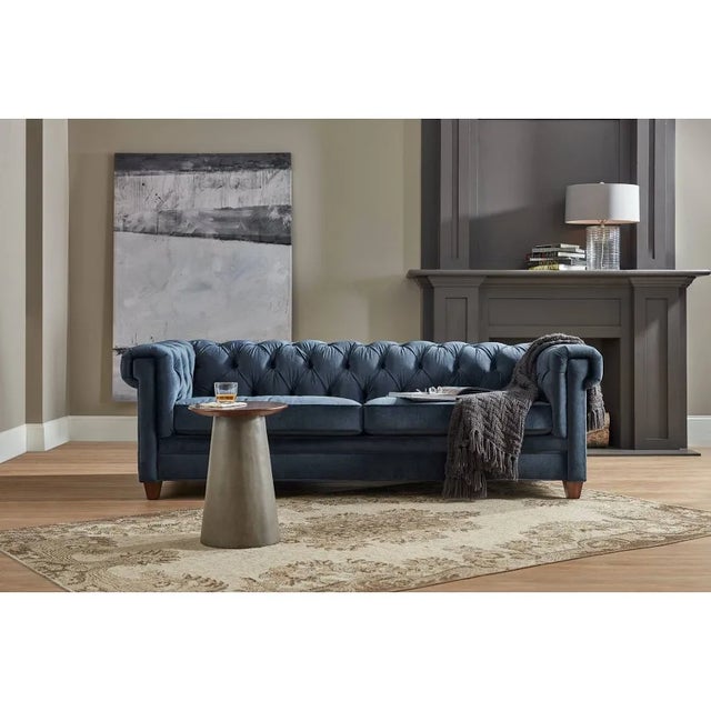 The timeless Chesterfield Sofa gets cozy, covered in the inviting and rich slate blue Mystere Eclipse fabric with a...