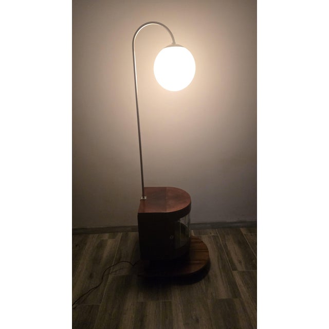 Art Deco Wooden Floor Lamp, in Good conditions. Designed 1920 to 1949 European Plug (up to 250V).The wiring of this item...