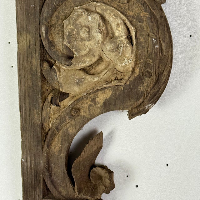 An unusual pair of architectural salvage vintage wood elements with remnant paint. The design on them includes scrolls &...
