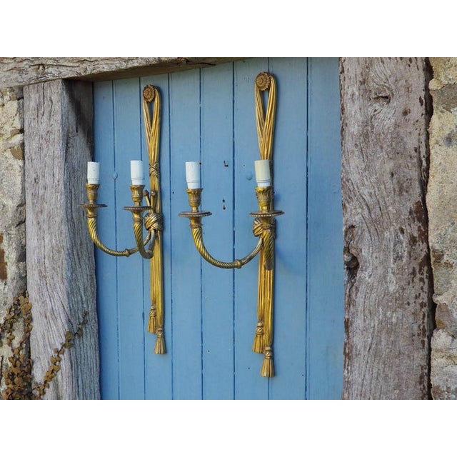 Large Antique Louis XVI Style Rope Tassel Wall Lights in Gilt Bronze, 1890s, Set of 2, in Very Good conditions. Designed...