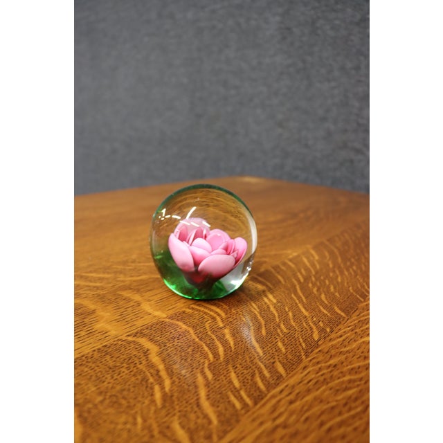 Handcrafted Swedish crystal paperweight by Måts Jonasson featuring a beautifully detailed pink rose blossom with rich...
