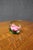 Handcrafted Swedish crystal paperweight by Måts Jonasson featuring a beautifully detailed pink rose blossom with rich...