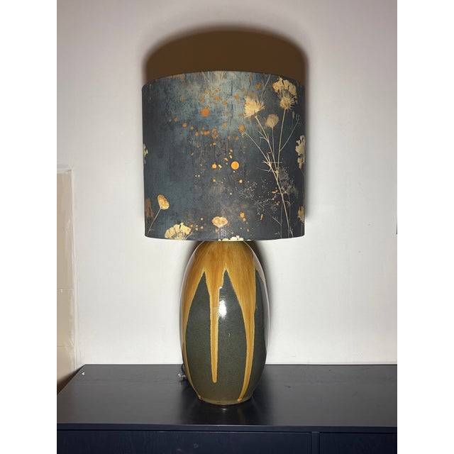 Pair of stunning ceramic table lamps with rich ochre and charcoal glaze finish. Handsome custom lamp shades.