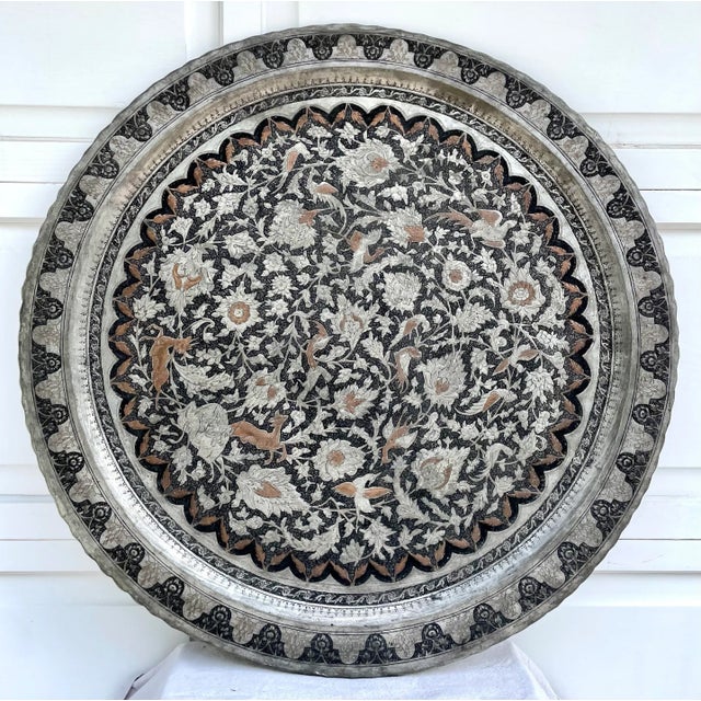 Here is an absolutely stunning Islamic/Moroccan metal tray tabletop in silver, black and copper metal finishes. The piece...
