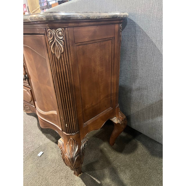 This exquisite Michael Amini Tuscan-style buffet showcases Old World craftsmanship paired with timeless luxury. Crafted...