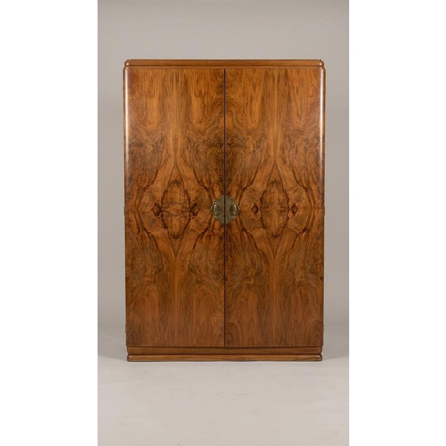 Vintage Art Deco Wardrobe Cabinet in Burl Walnut, 1930s, in Flawless conditions. Designed 1920 to 1949 This piece has an...