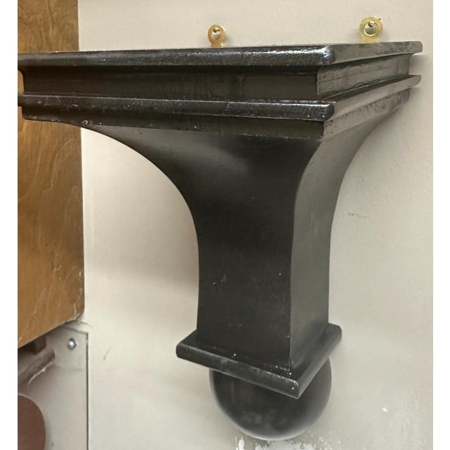 Very well executed and made of solid wood pieced together like a butchers block table. In the classic style of a corbel...