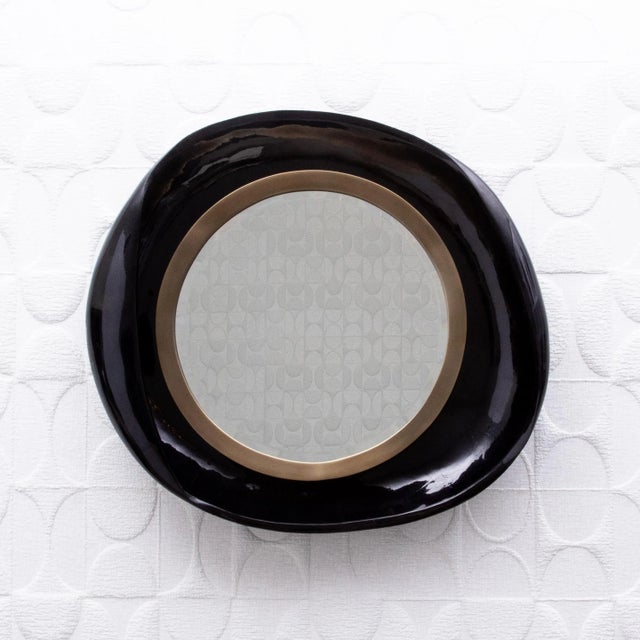 The "Petal Mirror" by R&Y Augousti, with its graceful curves and impeccable design, epitomizes the allure of modern luxury...