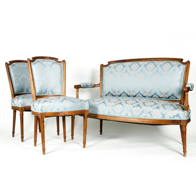 Antique French seating set settee with two-side chairs. Each piece is in excellent antique condition. The settee measures...