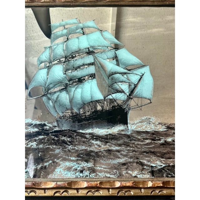 Make a bold statement with this striking mid-century nautical mirror featuring a classic clipper ship sailing through...