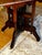 Eastlake center parlor table in excellent condition. Walnut with carved detailing & white ceramic caster also in excellent...