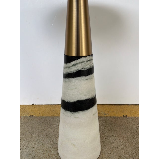 Sculptural round Revelation Pier Accent Table / Black &White Marble. Brass Details. Stripped base. Showroom floor sample.