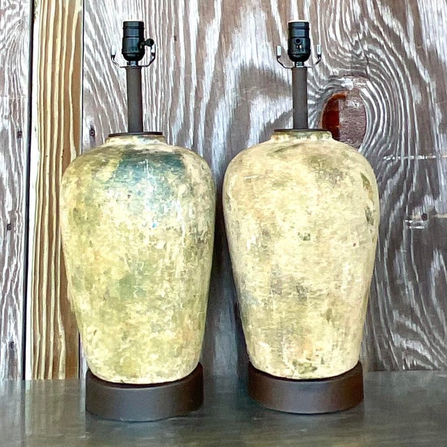 Light up your space with our Vintage Boho Patinated Ceramic Table Lamps. Sold as a pair, these American-selected lamps...