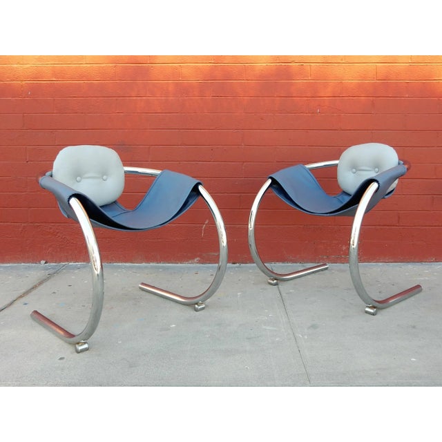 Pair of fat chrome-plated steel tube sling lounge chairs designed by Byron Botker for Landes of California. Very...