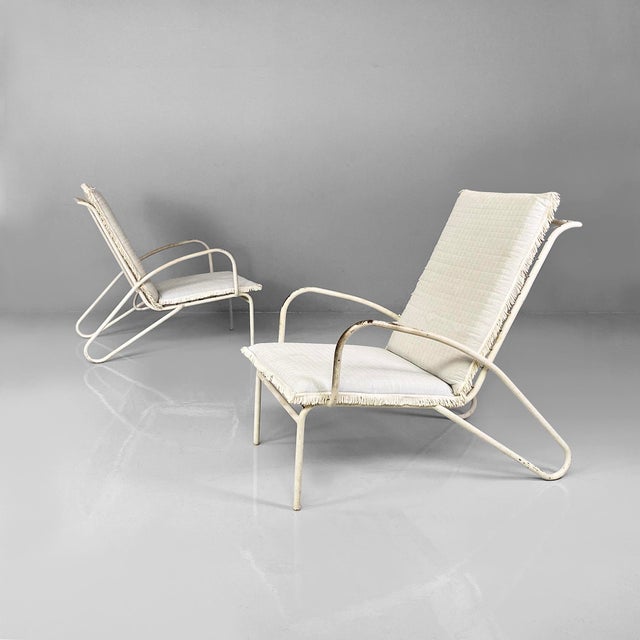 Italian mid-century outdoor white and azure iron armchairs, 1960s. Pair of outdoor armchairs in white painted iron. The...