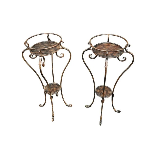 A Pair of Neoclassical Style Patinated forged Metal Planter Stands. Stand 33.25" tall. Top inside diameter is 10.75" and...