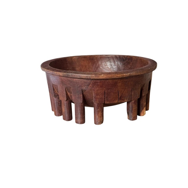 A large 20th Century Samoan circular wooden kava bowl called a tanoa fai'ava and carved from a single piece of wood,...