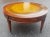 A MId-Century Fruitwood Two-Tier Coffee Table or Cocktail Table in good vintage condition. Measures 32" in diameter and...