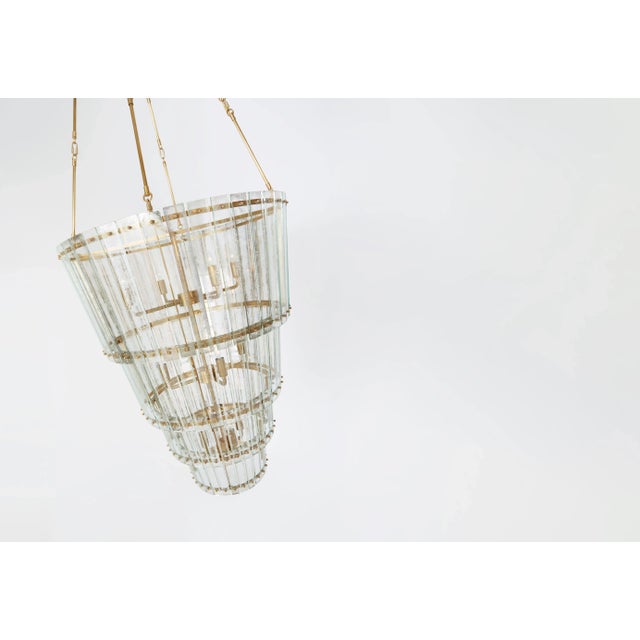 Cadence Large Waterfall Chandelier in Hand-Rubbed Antique Brass with Antique Mirror Designer: Carrier and Company Fixture...