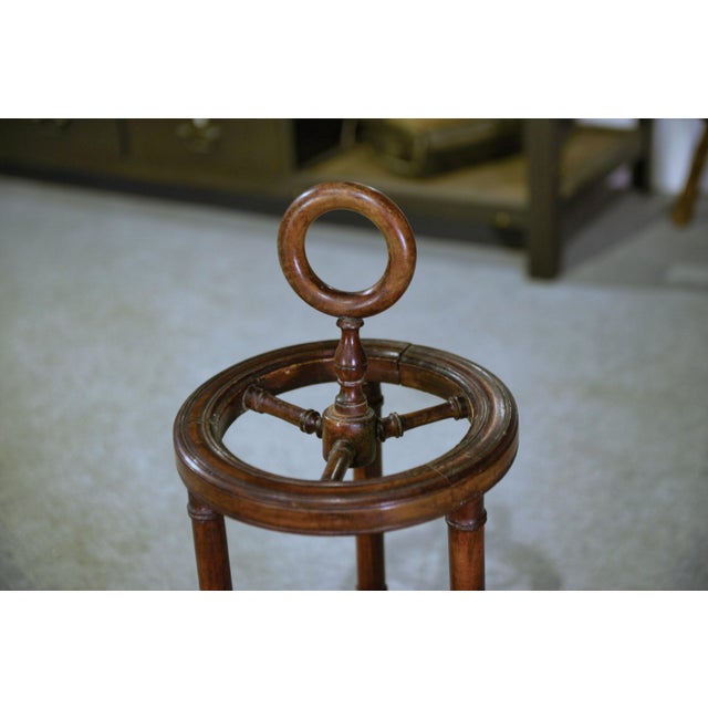 A stained beechwood umbrella stand, turned to resemble bamboo, typical of the craze for exoticism that resurfaced in the...
