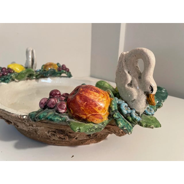 Offering a gorgeous Italian Centerpiece Bowl made of Porcelain with handles of Fruit and Swans. By Abigails. Heavy, 16...
