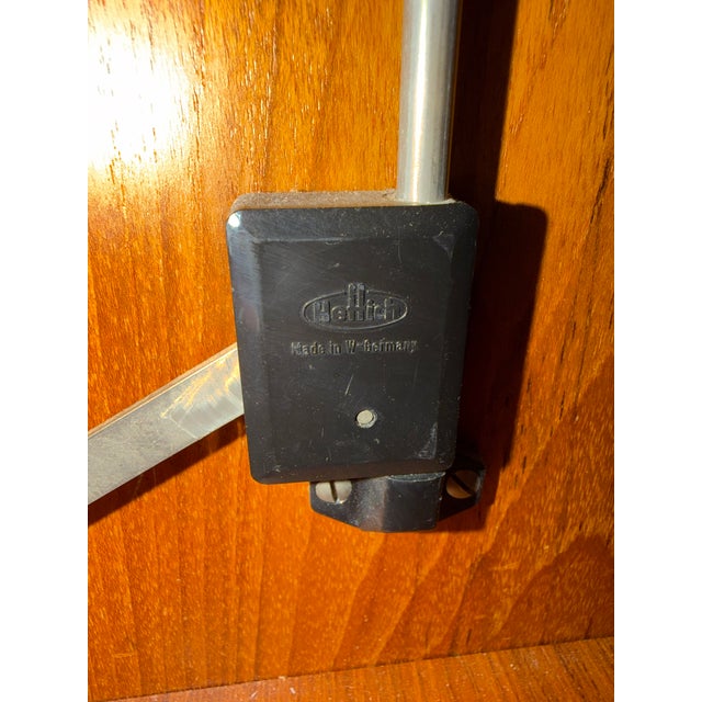 A beautifully crafted vintage Danish modern cabinet featuring clean architectural lines, warm teak grain, and functional...