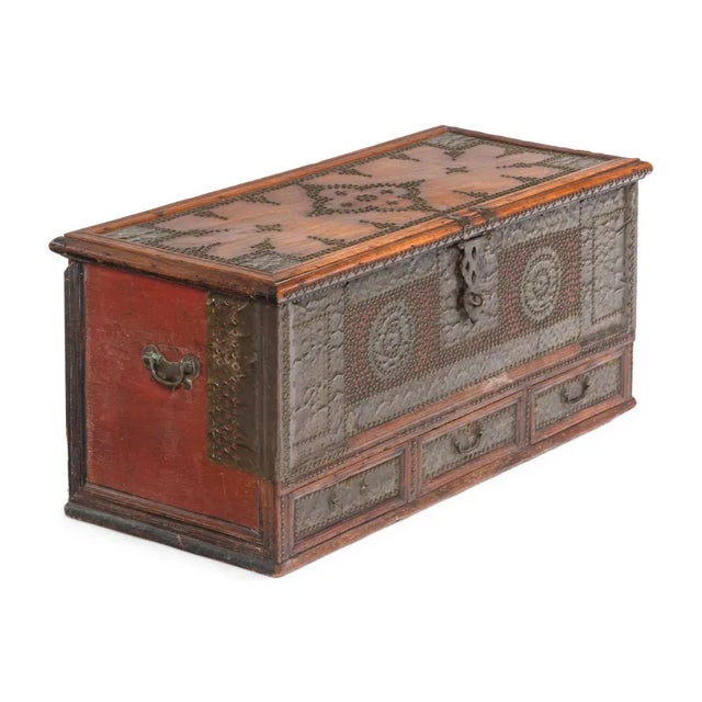 A rare 19th-century Zanzibar chest made of thick teak slabs and outfitted with brass studs in a stunning design on the...