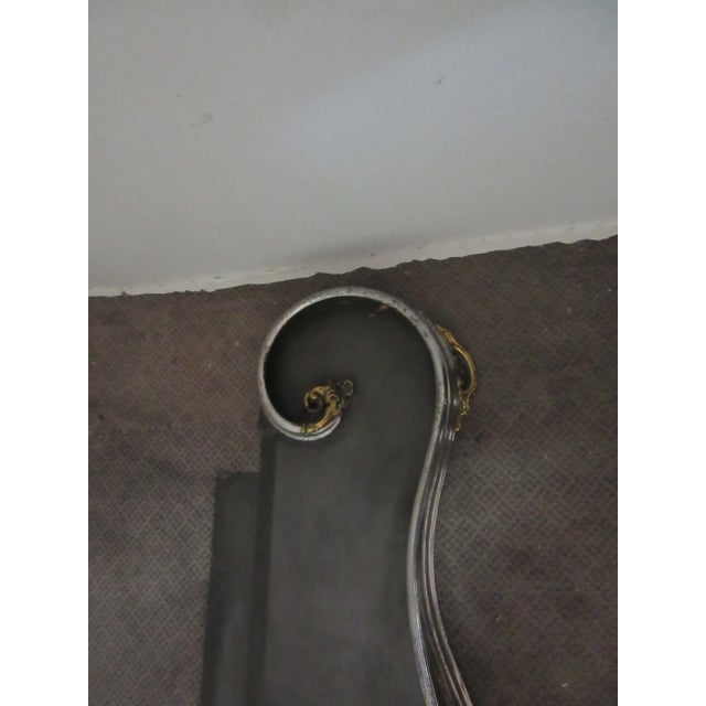 Fabulous Art Nouveau solid steel fireplace fender. Beautiful brass ornamentation with a shell in the middle of the fender....