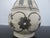 Chinese Cizhou Kiln pear-shaped pottery vase featuring floral designs on a cream white base. Features a distinctive pear-...