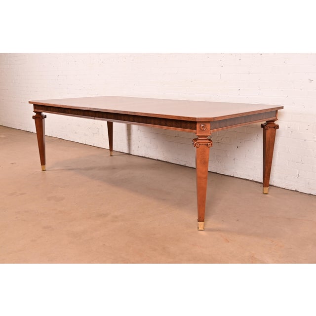 An exceptional French Regency Louis XVI or Neoclassical style dining table By Theodore Alexander Circa Early 21st Century...