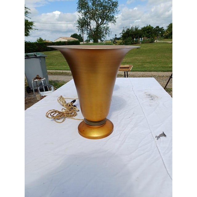 Pair of 1960s gold-plated aluminum lamps, rimmed with glass at the bottom, Height: 35.5 cm, Top Diameter: 32.5 cm and...