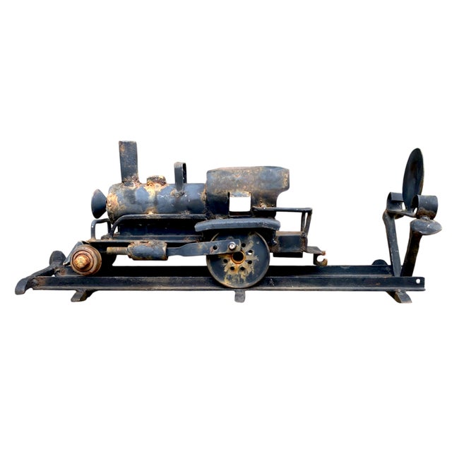Awesome vintage and very heavy welded metal steam locomotive sculpture mounted on its own section of railroad track,...