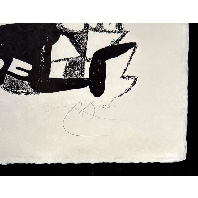Lithograph on Japan paper. Hand signed lower right by Joan Miro. Hand numbered 'III/XX" lower left (there was also an...