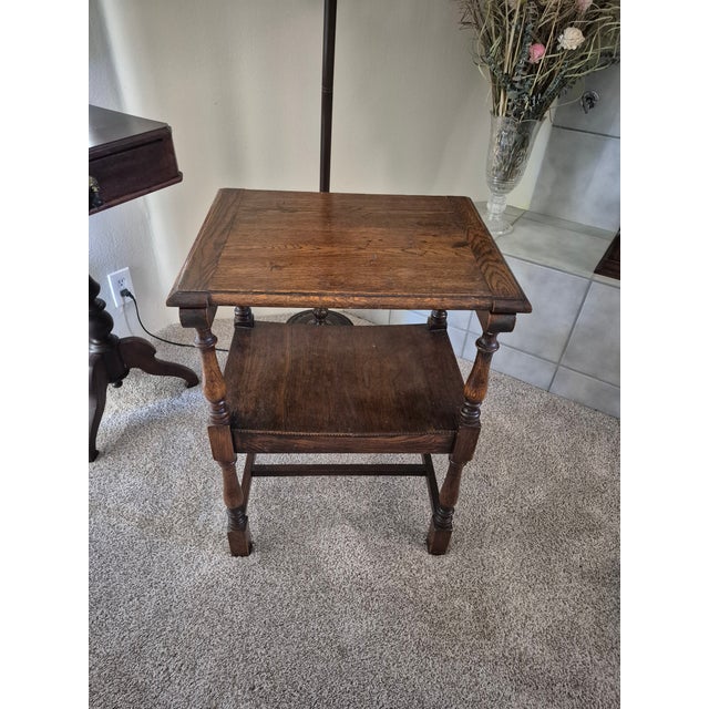 This 17th century style Jacobean renaissance monk's bench and table features turned legs and a carved back panel. This...