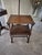 This 17th century style Jacobean renaissance monk's bench and table features turned legs and a carved back panel. This...