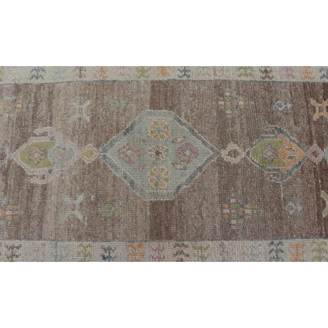 Textile Turkish Oushak Runner With Soft Brown Field and Pale Blue Geometric Medallions For Sale - Image 7 of 12